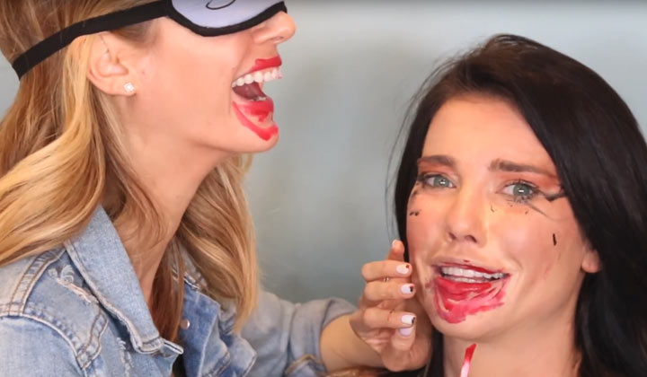Jacqueline MacInnes Wood and Kelly Kruger apply each other's makeup while blindfolded