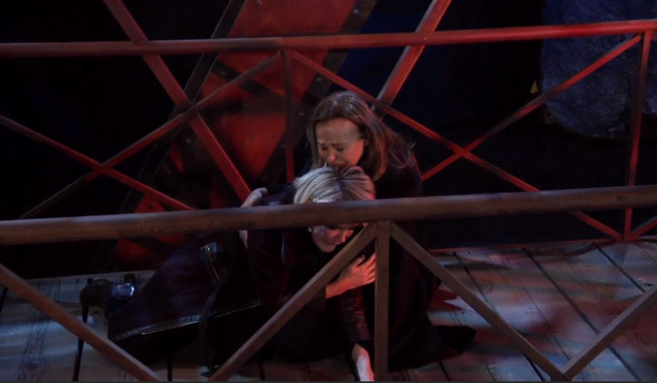 Laura embraces a distraught Ava on the bridge where she nearly lost her life